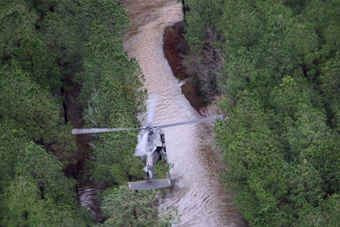 A UH-60 Black Hawk helicopter flies over a flooded area looking for people stranded by the rising waters during flood response operations in Winnfield, La., March 10, 2016. The helicopter crew is assigned to the Louisiana National Guard’s Company F, 2nd Battalion, 135th General Aviation Battalion. Louisiana Army National Guard photo by Spc. Megan Zander