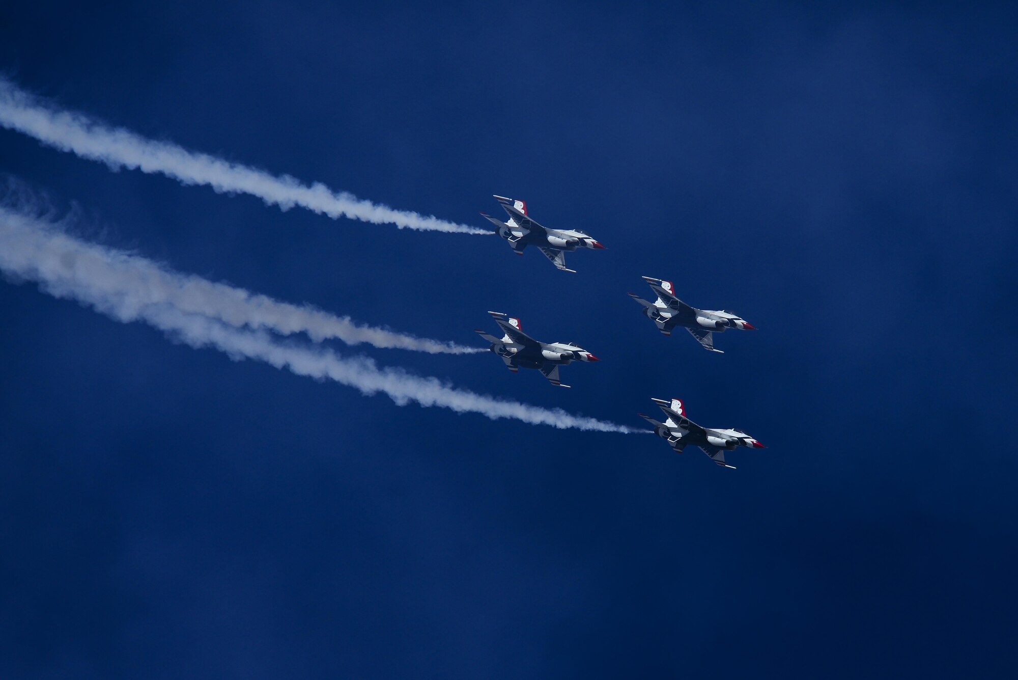 U.S. Air Force Air Demonstration Squadron, the Thunderbirds, fly at the end of an “Arrowhead Loop” maneuver during the Thunder and Lightning over Arizona Open House event at Davis-Monthan Air Force Base, Ariz., March 12, 2016. The hour-long demonstration gave spectators the chance to witness the precise maneuvers and capabilities exhibited by these F-16 Fighting Falcon pilots. (U.S. Air Force photo by Senior Airman Chris Drzazgowski/Released) 