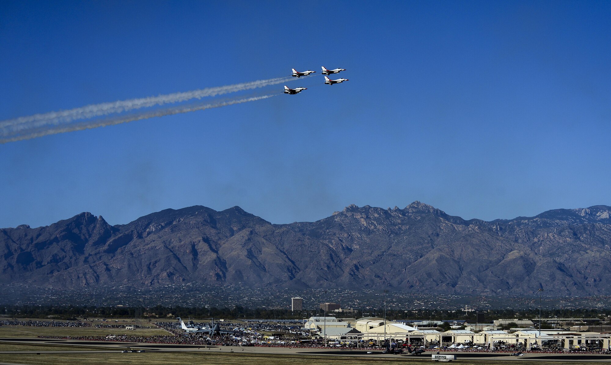 U.S. Air Force Air Demonstration Squadron, the Thunderbirds, fly in a diamond formation during the Thunder and Lightning over Arizona Open House event at Davis-Monthan Air Force Base, Ariz., March 12, 2016. The hour-long demonstration gave spectators the chance to witness the precise maneuvers and capabilities exhibited by these F-16 Fighting Falcon pilots. (U.S. Air Force photo by Senior Airman Chris Drzazgowski/Released)