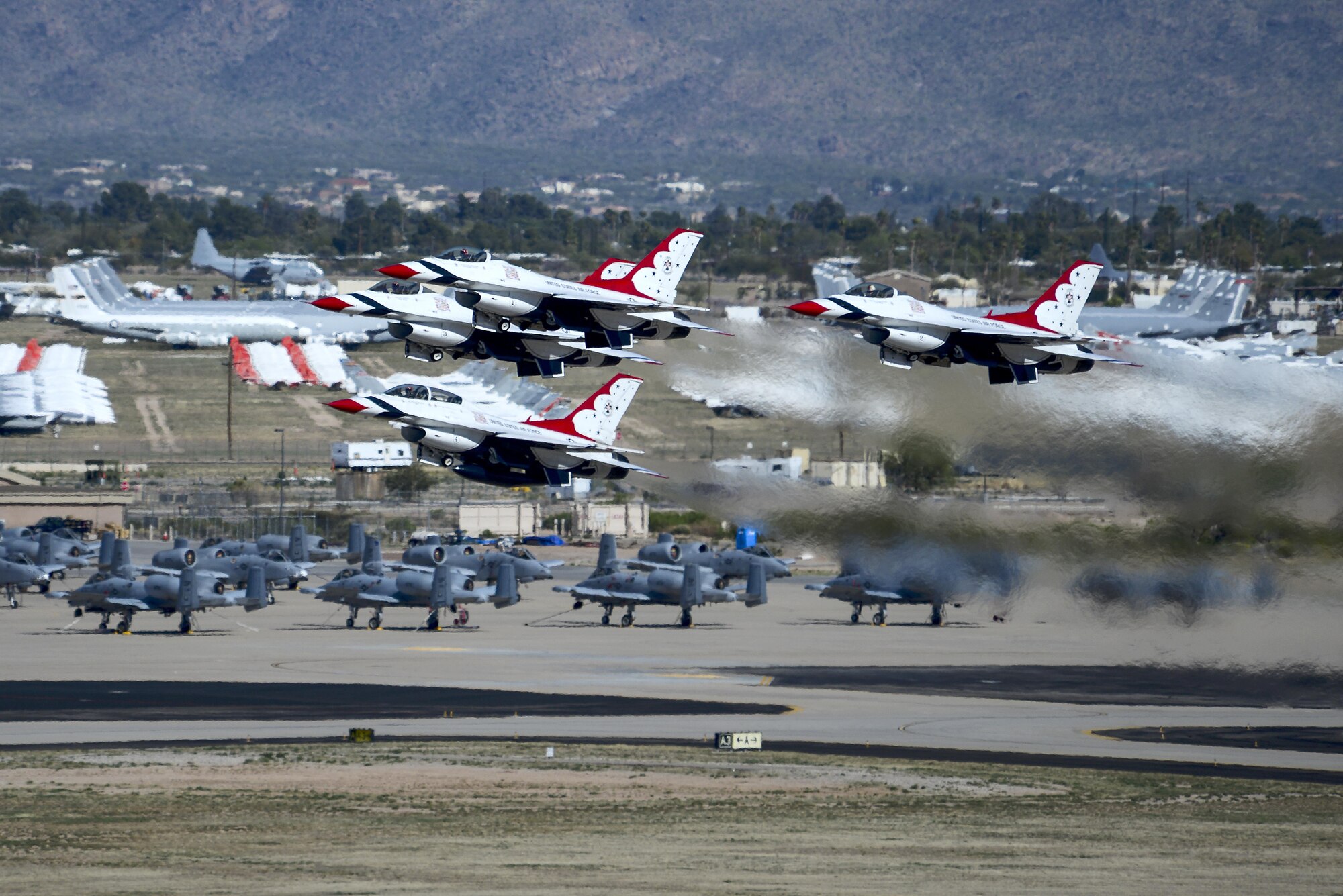 U.S. Air Force Air Demonstration Squadron, the Thunderbirds, takeoff to begin their performance during the Thunder and Lightning over Arizona Open House event at Davis-Monthan Air Force Base, Ariz., March 12, 2016. The hour-long demonstration gave spectators the chance to witness the precise maneuvers and capabilities exhibited by these F-16 Fighting Falcon pilots. (U.S. Air Force photo by Senior Airman Chris Drzazgowski/Released)