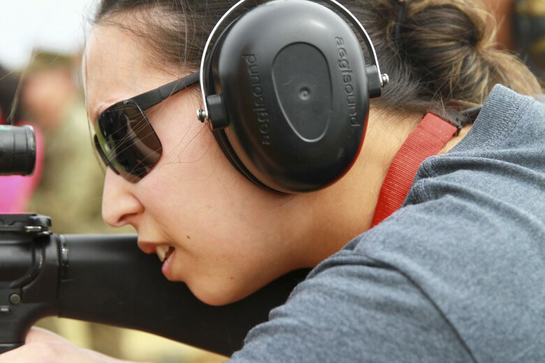 Lorraine Selke, director of bands at West Chester East High School, looks down the scope of an M-16 A4 service rifle during an Educator Workshop at Marine Corps Recruit Depot Parris Island, S.C., March 9, 2016. The Marine Corps invited teachers from throughout the north east area to see how Marines are made aboard the depot. The educators were given the opportunity to shoot the same weapons as used by recruits and were accompanied by Marine Corps marksman instructors. (U.S. Marine Corps photo by Cpl. Brandon Thomas)