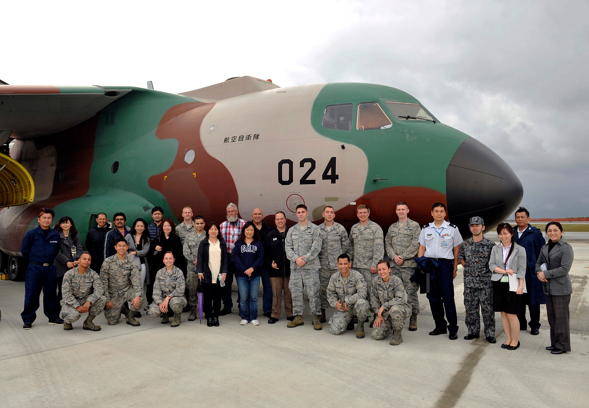 Members from the 733rd Air Mobility Squadron and Japan Air Self Defense Force pose for group photo in front of a JASDF C-1 cargo jet during a tour, March 10, 2016, at Naha Air Base, Japan. 733rd AMS Airmen performed an exchange with JASDF members to tour operations at Aerial Port to foster better communication, understanding, and friendship between the U.S. Air Force and JASDF partners. (U.S. Air Force photo by Naoto Anazawa)

