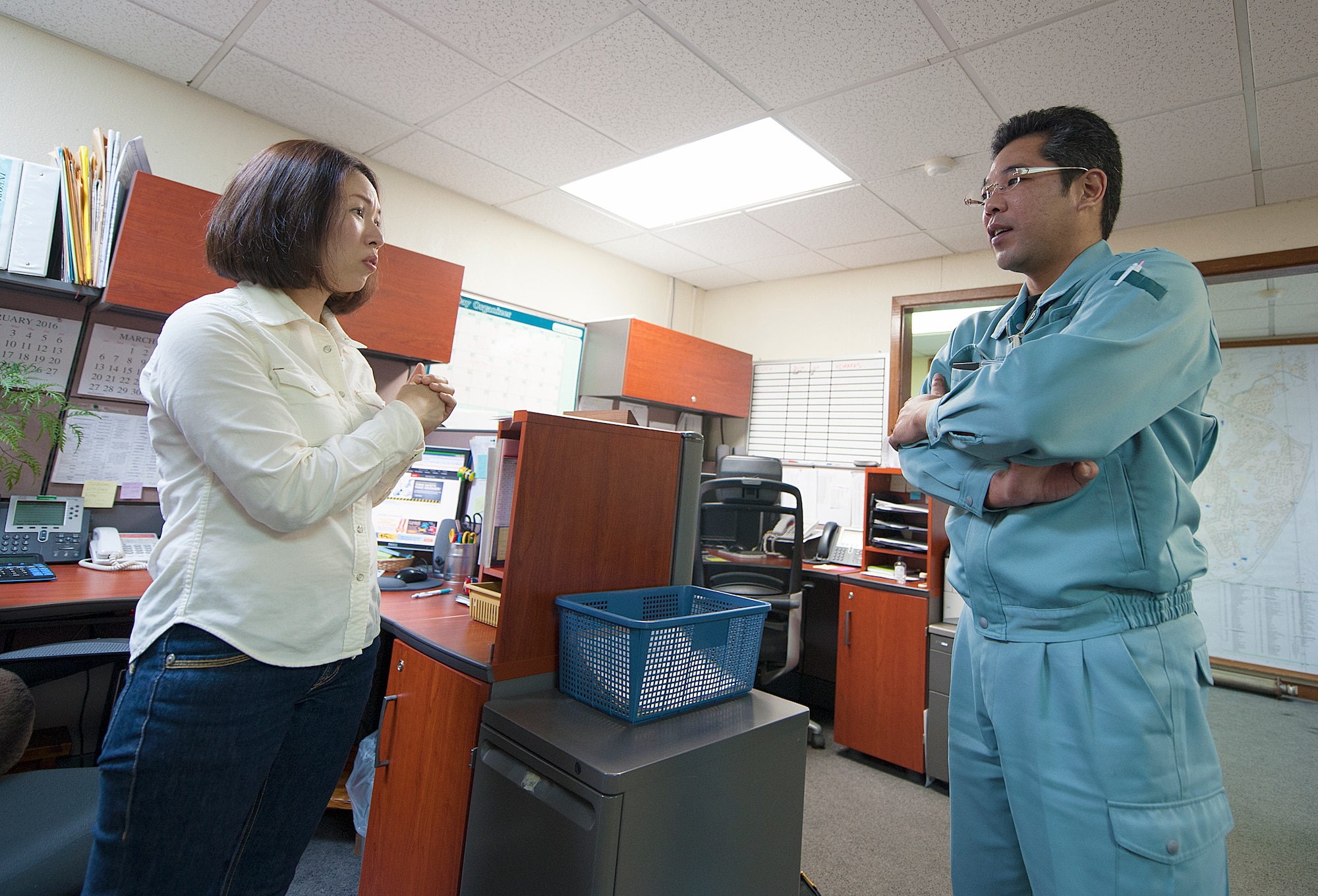 Ayano Kinjo, 18th Civil Engineer Squadron facilities repair estimator, talks to Tomofumi Mekaru, Kanemitsu Reisho CO., LTD sales manager about the quotes of supply for 18th CES, March 9, 2016, at Kadena Air Base, Japan. Kinjo aims to continue work with the 18th CES and further develop relations with Okinawan vendors. (U.S. Air Force photo by Naoto Anazawa)


