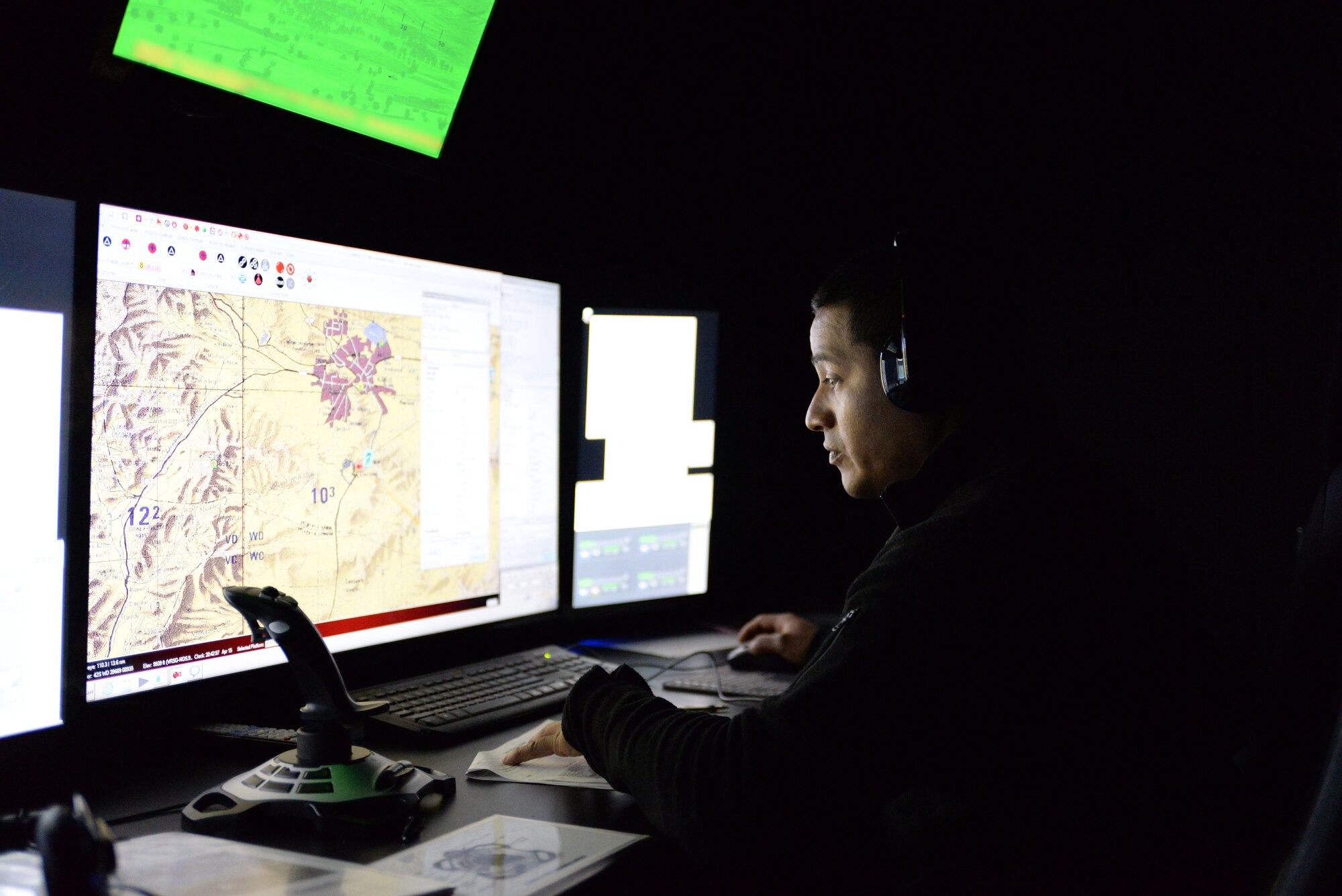 A picture of Harry Nieves, civilian contractor, sitting at the console of the 227th Air Support Operations Squadron's (ASOS) new $1.2 million Air National Guard Advanced JTAC Training System.