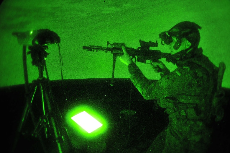 A picture of German armed forces 1st Lt. Tim Jantzen, Joint Terminal Attack Controller (JTAC) with the 131st Artillery Battalion in Weiden, Germany, aiming a training weapon inside the 227th Air Support Operations Squadron's new Air National Guard Advanced JTAC Training System.