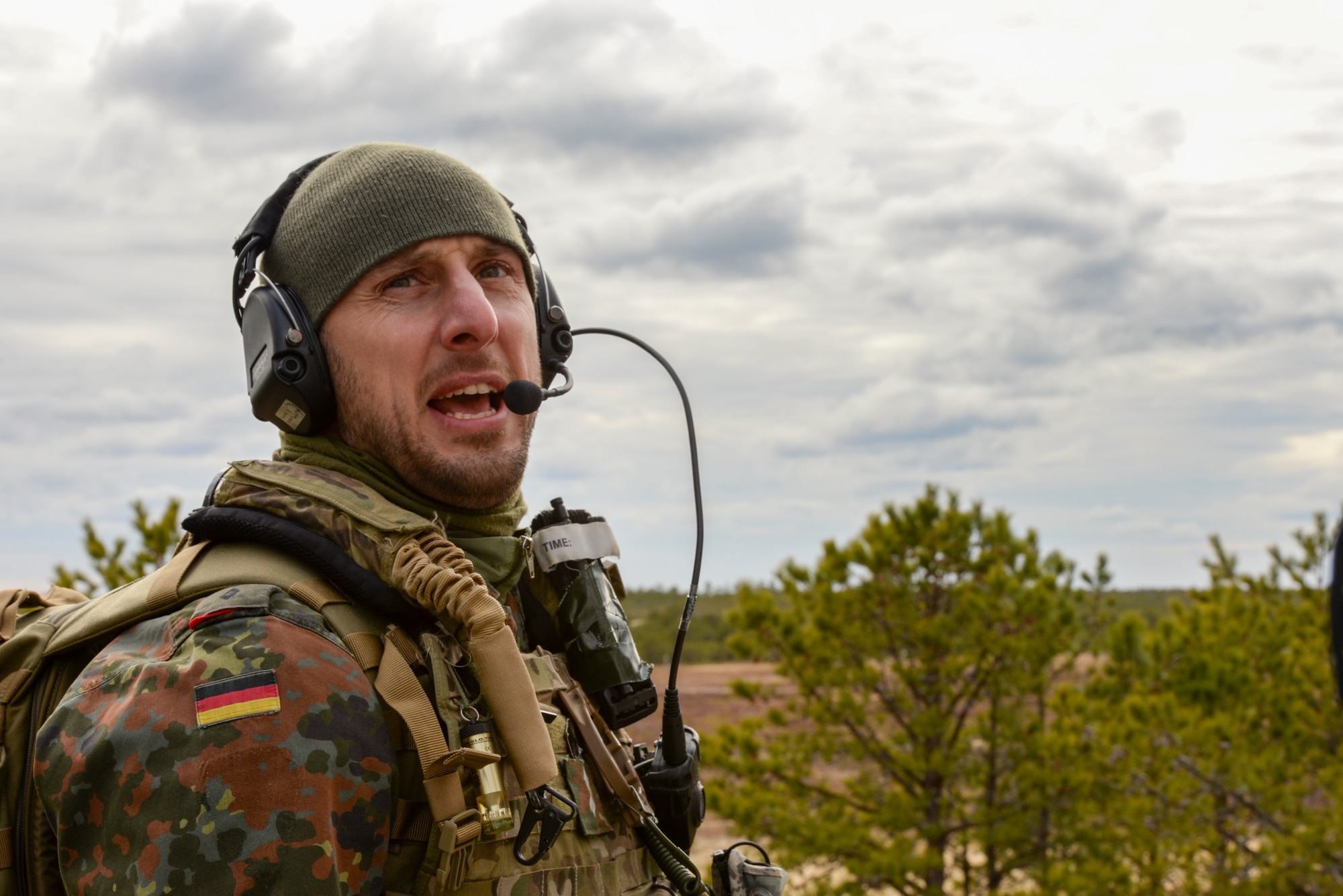 A picture of German armed forces 1st Lt. Marius Sokol, Joint Terminal Attack Controller (JTAC) from the 131st Artillery Battalion in Weiden, Germany, performing close air support training.