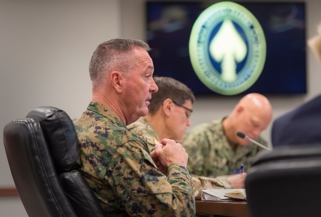 Marine Corps Gen. Joseph F. Dunford Jr., chairman of the Joint Chiefs of Staff, foreground, speaks with general and flag officers during a briefing alongside Gen. Joseph L. Votel, commander of U.S. Special Operations Command, on MacDill Air Force Base, Fla., March 11, 2016. DoD photo by Navy Petty Officer 2nd Class Dominique A. Pineiro