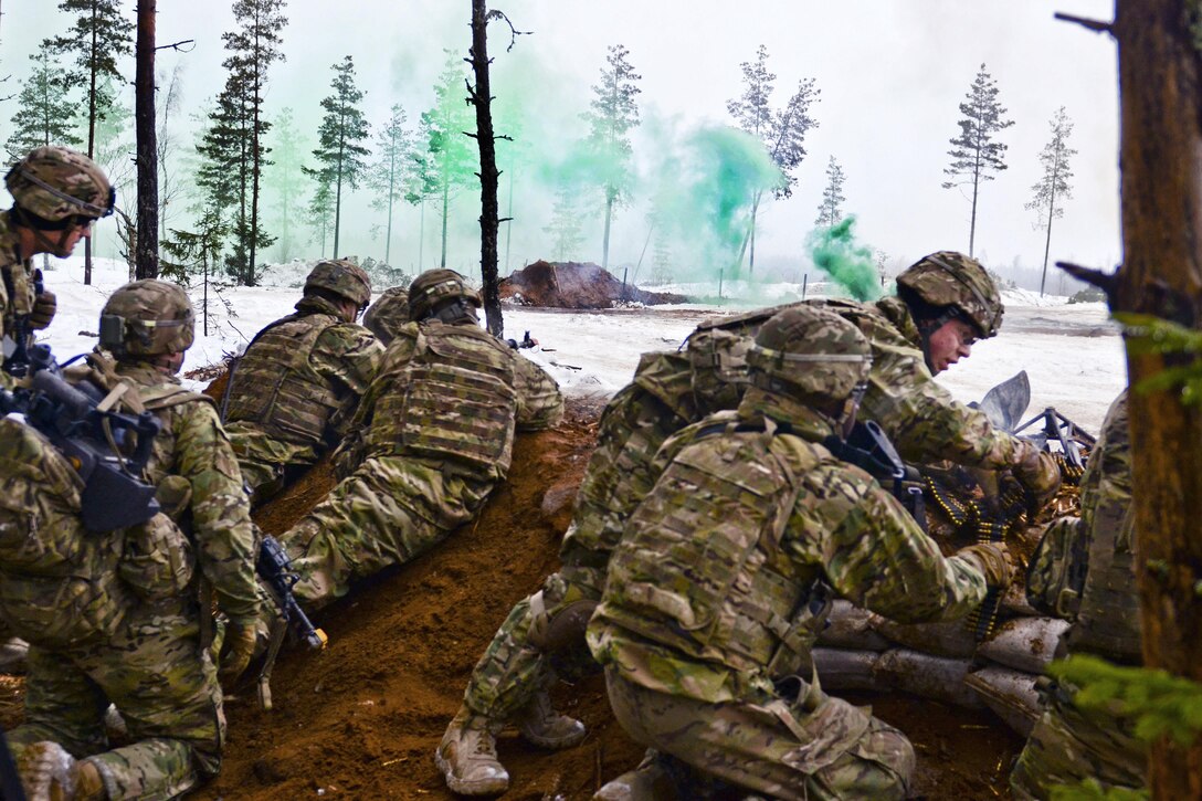 Soldiers reach a berm to set up an assault line during a live-fire exercise at Tapa Training Area in Estonia, March 12, 2016. The soldiers are assigned to the 3rd Squadron, 2nd Cavalry Regiment. Army photo by Staff Sgt. Steven M. Colvin