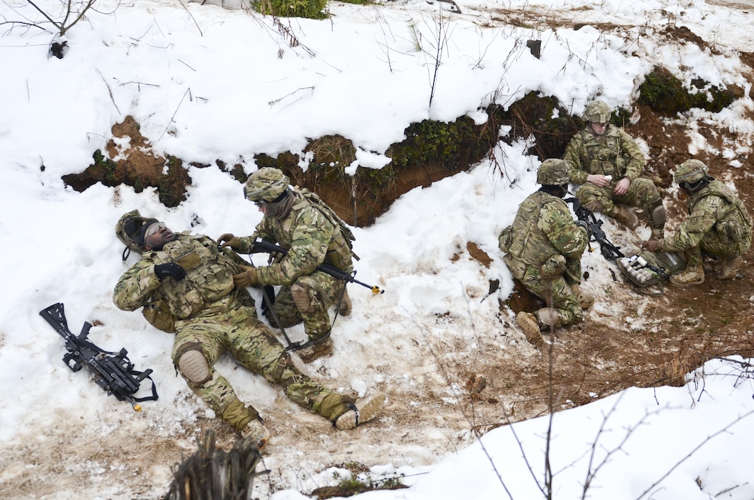 Soldiers perform tactical casualty care during a live-fire exercise at Tapa Training Area in Estonia, March 12, 2016. Army photo by Staff Sgt. Steven M. Colvin