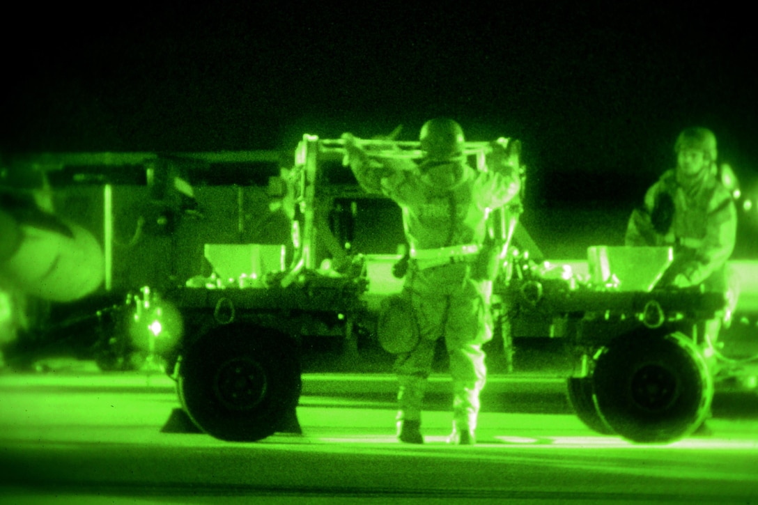 As seen through a night-vision device, airmen conduct night flight line operations on an F-16 Fighting Falcon during Exercise Dastardly Devil 16-1 at the Atlantic City Air National Guard Base, N.J., March 12, 2016. New Jersey Air National Guard photo by Tech. Sgt. Andrew Merlock