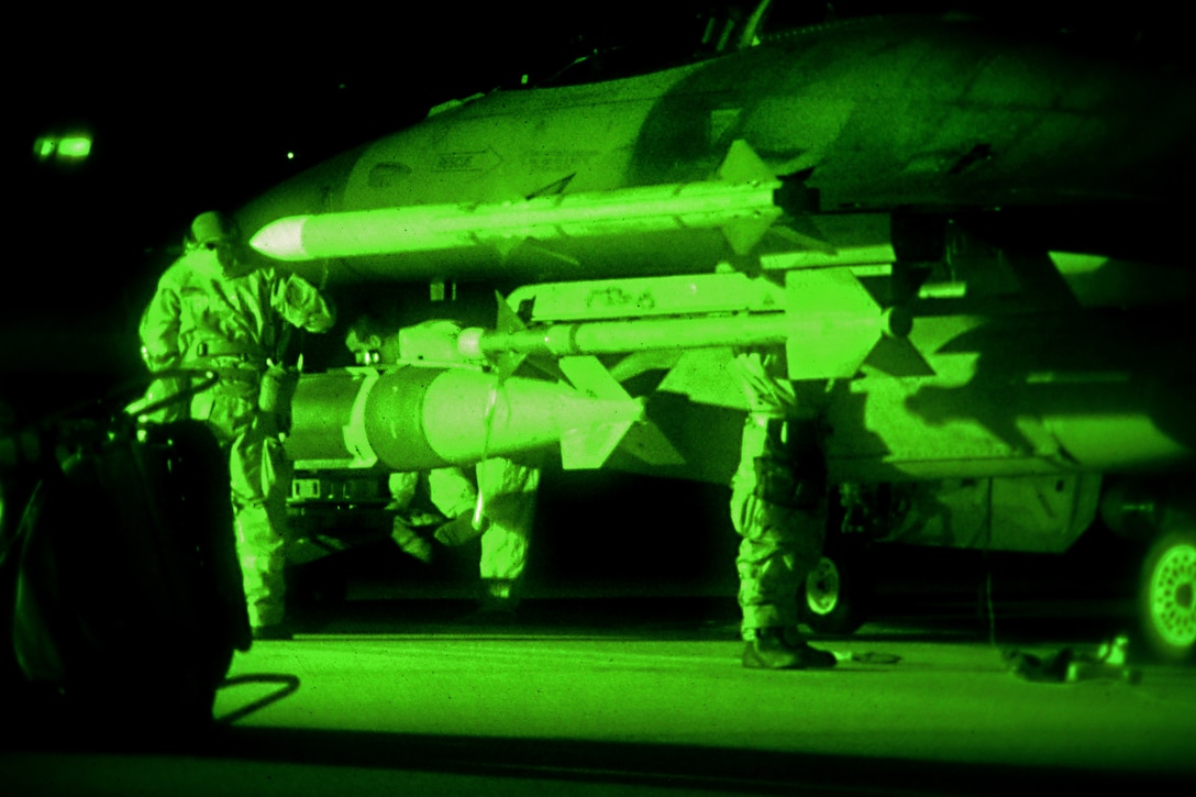 As seen through a night-vision device, airmen conduct night flight line operations on an F-16 Fighting Falcon during Exercise Dastardly Devil 16-1 at the Atlantic City Air National Guard Base, N.J., March 12, 2016. New Jersey Air National Guard photo by Tech. Sgt. Andrew Merlock