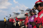 Sailors stand by while an F/A-18 Hornet launches from the flight deck of Nimitz-class aircraft carrier USS Dwight D. Eisenhower (CVN 69) Nov. 25, 2012. Defense Logistics Agency Aviation in Philadelphia has stood up a tactical tiger team to ensure the F/A-18 continues supporting the needs of the fleet. 