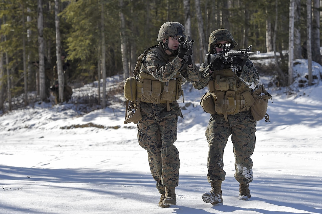 Marine Corps Lance Cpls. Nick Ruthruff, left, and Josh Harrison participate in training on Joint Base Elmendorf-Richardson, Alaska, March 6, 2016. Ruthruff and Harrison are assigned to Detachment Military Police Delta Company, 4th Law Enforcement Battalion. Air Force photo by Alejandro Pena