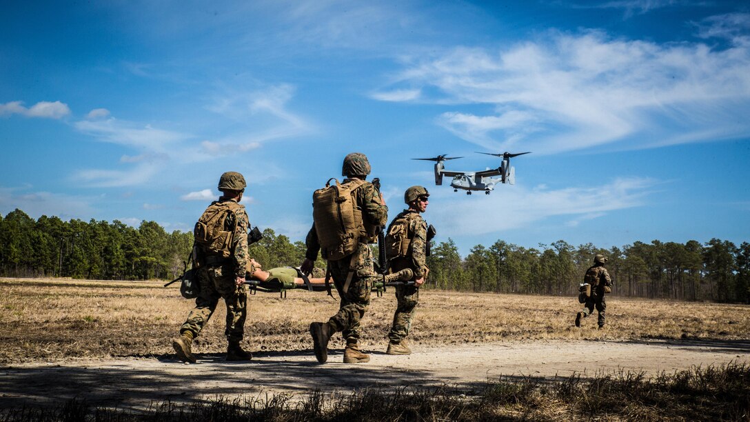 Marines with 2nd Combat Engineer Battalion, run to the landing point to load a casualty onto an MV-22B Osprey, during a casualty evacuation exercise at Landing Zone Penguin at Marine Corps Base Camp Lejeune, N.C., March 10, 2016. The training allowed Marines with Marine Medium Tiltrotor Squadron 365 and 2nd CEB to work together in order to be well prepared to conduct a successful CASEVAC in any situation they may encounter while deployed, to ultimately save lives. 