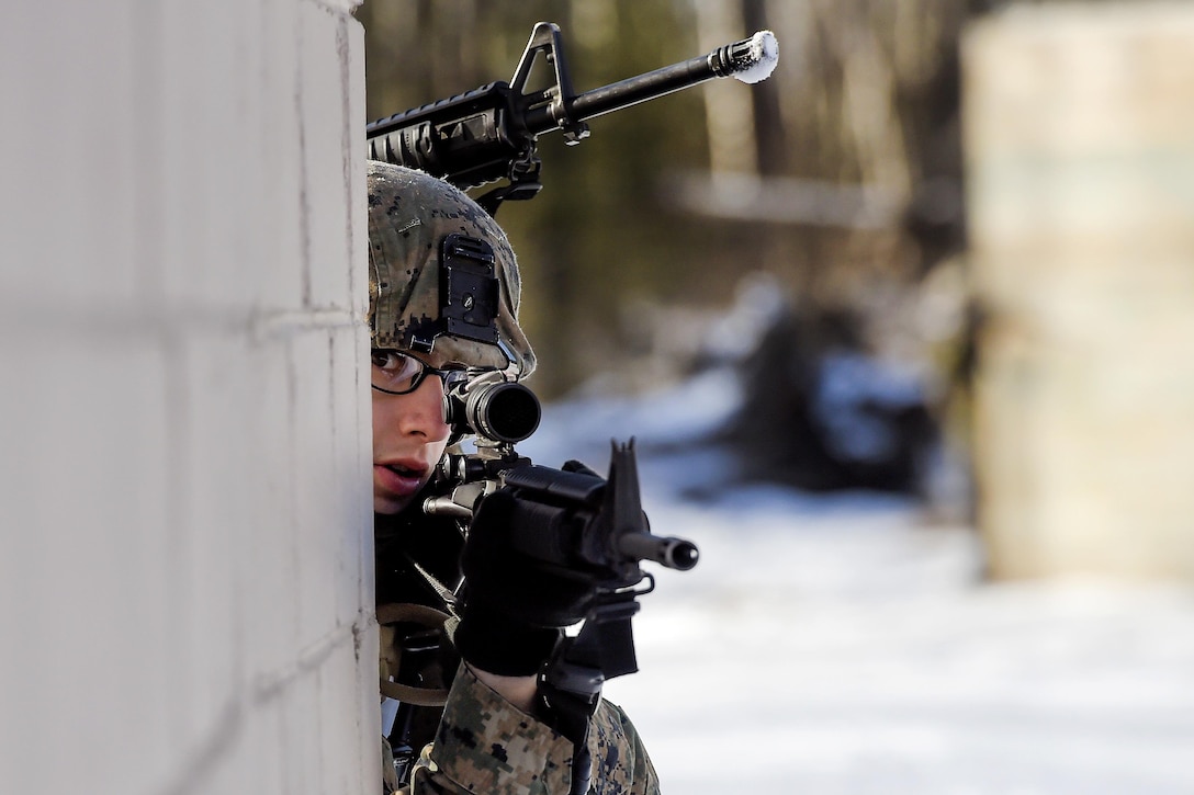 Marine Corps Lance Cpl. Nick Ruthruff provides security during urban terrain training on Joint Base Elmendorf-Richardson, Alaska, March 6, 2016. Ruthruff is assigned to Detachment Military Police Delta Company, 4th Law Enforcement Battalion. Air Force photo by Alejandro Pena