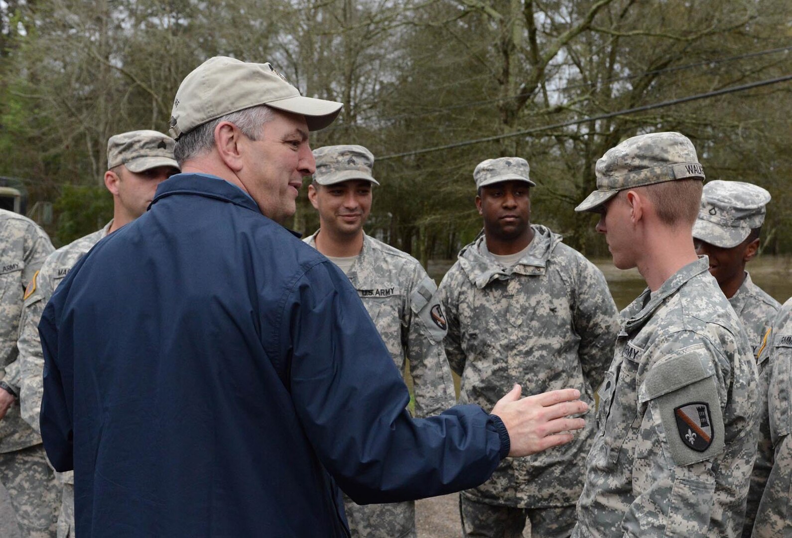 Gov. John Bel Edwards surveys flooded areas and thanks Louisiana National Guard members who have been assisting local agencies around the clock in Ponchatoula on March 12, 2016. 