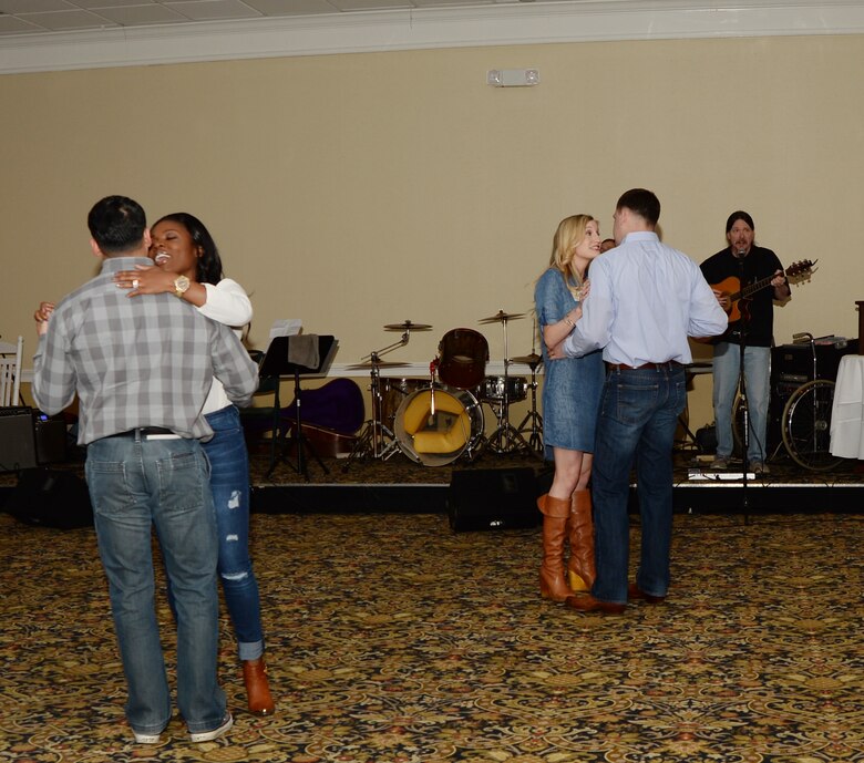 Guests enjoyed dancing to live music during the Officers’ Spouses’ Club Denim and Diamonds Scholarship and Charity Fundraiser held at Merry Acres Inn & Event Center recently. The auction was held to raise funds for military dependents, spouses and non-profit organizations.