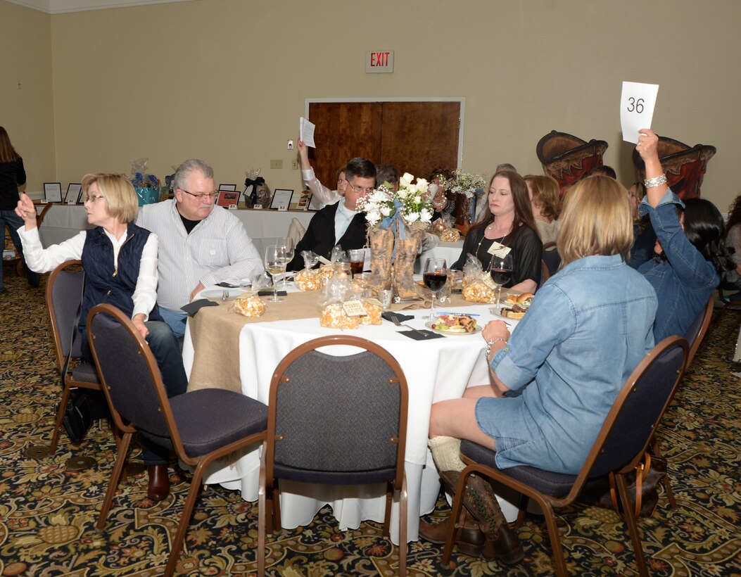 There were several friendly bidding wars during the Officers’ Spouses’ Club Denim and Diamonds Scholarship and Charity Fundraiser held at Merry Acres Inn & Event Center recently. The auction was held to raise funds for military dependents, spouses and non-profit organizations. 