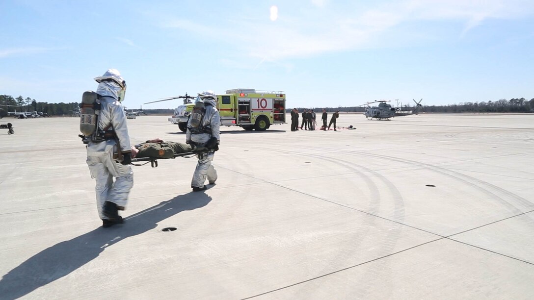 Aircraft Rescue and Fire Fighting Marines take an injured Marine from an MV-22B Osprey during a simulated hard landing at Marine Corps Air Station New River March, 7, 2016. Crash fire rescue conducts the simulated drill multiple times a week to guarantee their readiness and response to emergencies.