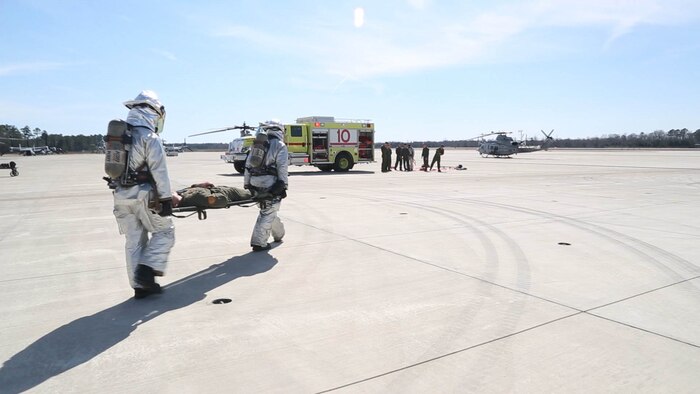 Aircraft Rescue and Fire Fighting Marines take an injured Marine from an MV-22B Osprey during a simulated hard landing at Marine Corps Air Station New River March, 7, 2016. Crash fire rescue conducts the simulated drill multiple times a week to guarantee their readiness and response to emergencies.