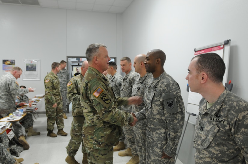 Brig. Gen. Scott Morcomb, Commanding General of the 11th Theater Aviation Command (TAC), greets his soldiers returning from an 11-month deployment to Kosovo in support of NATO’s KFOR mission, Mar. 7, 2016. The 11th TAC has deployed units to Kosovo over the last several years in support of this mission of establishing a safe and secure environment for the people of Kosovo. (U.S. Army Photo by Capt. Matthew Roman, 11th Theater Aviation Command Public Affairs Officer)
