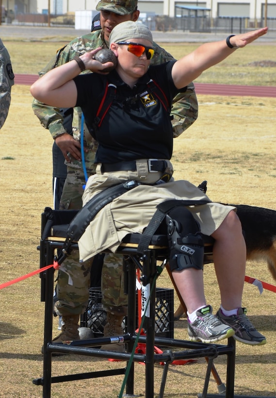 Army Staff Sgt. Tiffany Rodriguez-Rexroad, Warrior Transition Battalion, Brooke Army Medical Center, Fort Sam Houston, Texas, works to improve her shot put skills during a training session Feb. 28, 2016. More than 100 wounded, ill and injured soldiers and veterans were at Fort Bliss, Texas, to train and compete in a series of athletic events including archery, cycling, shooting, sitting volleyball, swimming, track and field, and wheelchair basketball to help in determining who will get a spot on the Army team for the 2016 Department of Defense Warrior Games. Army photo by Ronald Wolf