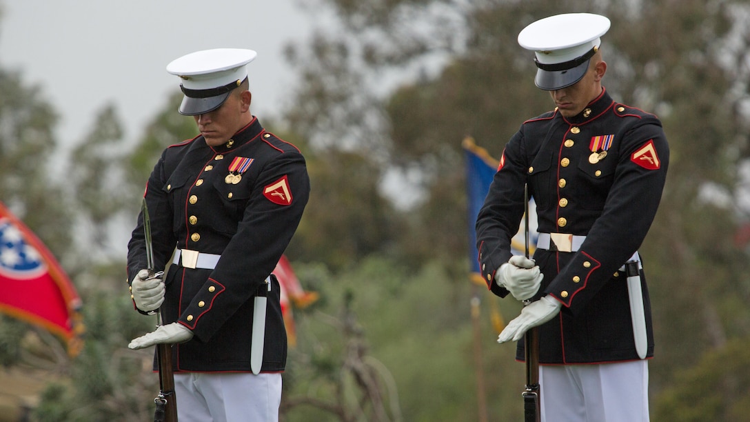 Marines with the Silent Drill Platoon affix bayonets to their rifles during a performance at Marine Corps Air Station Miramar, California, March 11. Their performance was part of the Battle Color Ceremony aboard the air station.