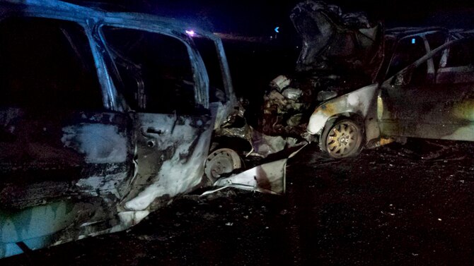 What is left of two cars after a potentially fatal accident sits on the side of the road May 12, 2014, near Royal Air Force Mildenhall, England. Staff Sgt. Vicente Gomez, a 100th Aircraft Maintenance Squadron crew chief, performed life-saving assistance to the victims of the crash. Gomez was presented with the Airman’s Medal for his courageous acts. (Courtesy photo)