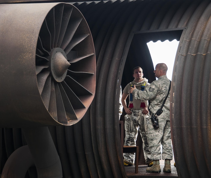 Tech. Sgt. Steven Gardner briefs Senior Airman William Clemens and other 919th Special Operations Wing firefighters about interior live-fire scenario they would encounter during the training March 4 at Hurlburt Field, Fla.  The Reserve Airmen teamed with their active-duty special operations firefighters to complete their annual live-fire training during the March unit training assembly.  (U.S. Air Force photo/Tech. Sgt. Sam King)