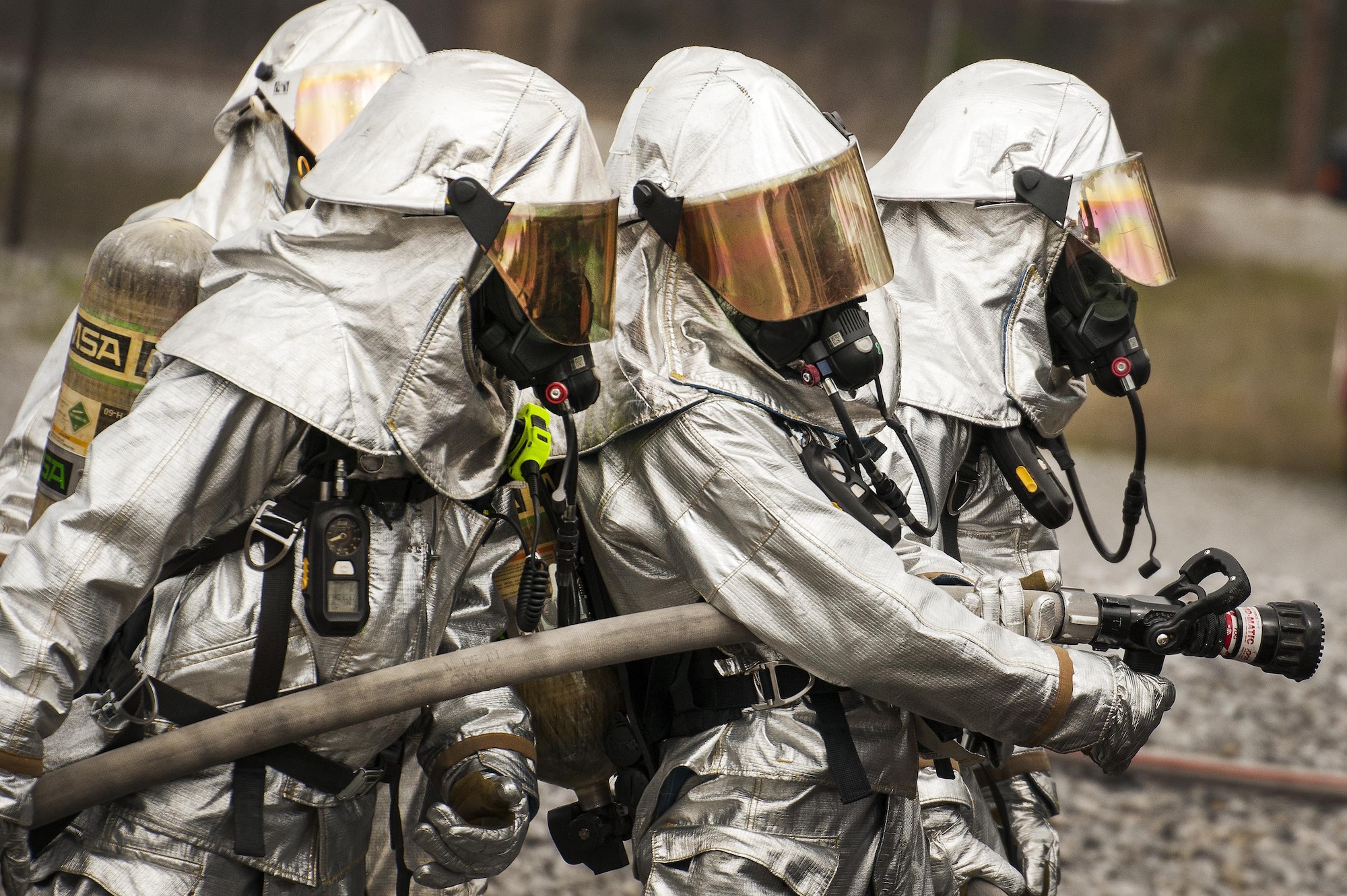 A team of 919th Special Operations Civil Engineer Squadron firefighters strategize their plan before entering the aircraft during a live-fire training exercise March 4 at Hurlburt Field, Fla.  The Reserve Airmen teamed with their active-duty special operations firefighters to complete their annual live-fire training during the March unit training assembly.  (U.S. Air Force photo/Tech. Sgt. Sam King)