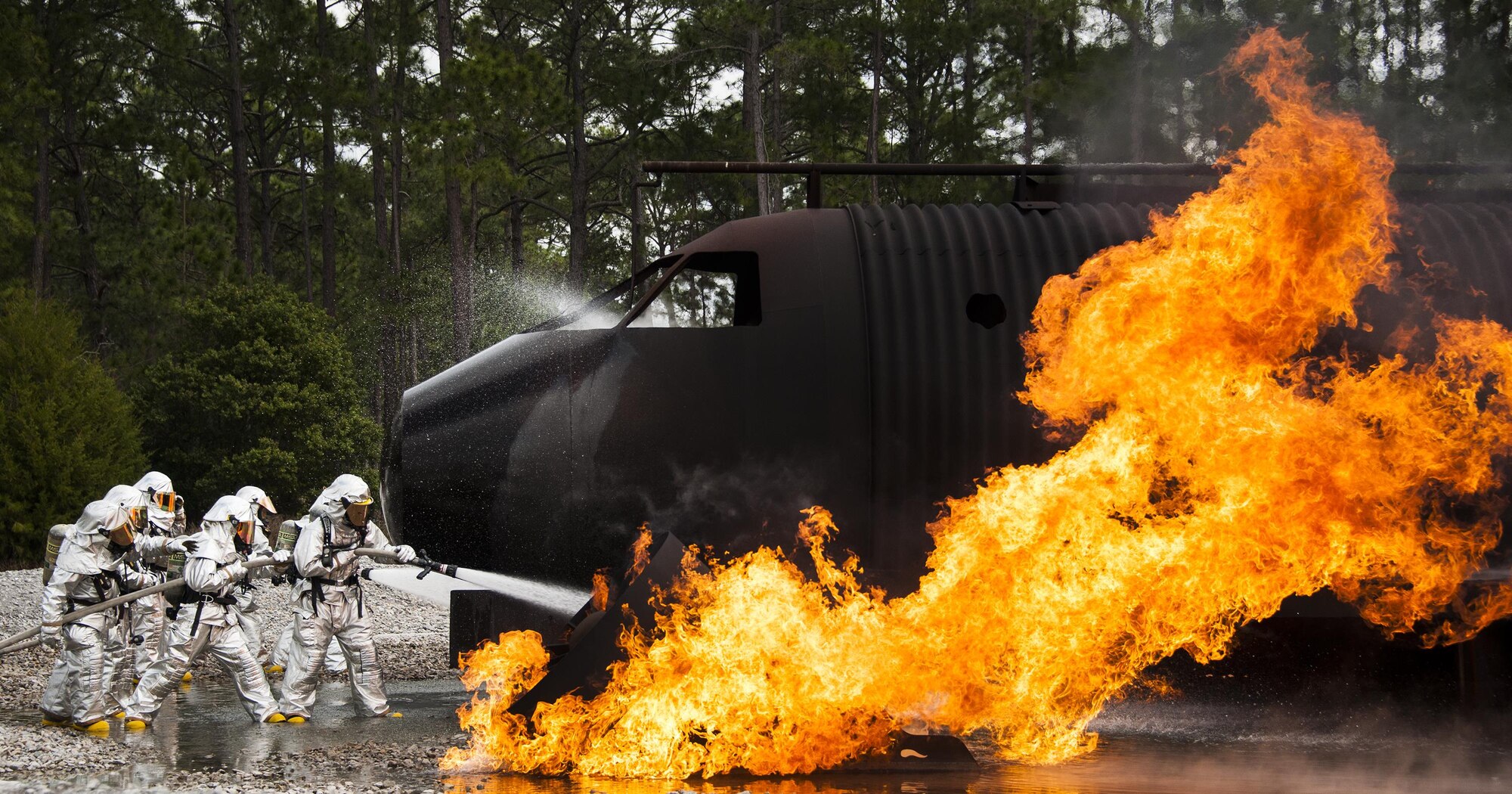 A team of 919th Special Operations Civil Engineer Squadron firefighters battle a blaze during a live-fire training exercise March 4 at Hurlburt Field, Fla.  The Reserve Airmen teamed with their active-duty special operations firefighters to complete their annual live-fire training during the March unit training assembly.  (U.S. Air Force photo/Tech. Sgt. Sam King)