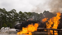 A team of 919th Special Operations Civil Engineer Squadron firefighters battle a huge blaze during a live-fire training exercise March 4 at Hurlburt Field, Fla.  The Reserve Airmen teamed with their active-duty special operations firefighters to complete their annual live-fire training during the March unit training assembly.  (U.S. Air Force photo/Tech. Sgt. Sam King)