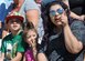 A family watches as Kent Pietsch operates the Jelly Belly aircraft while he performs aerial demonstrations during the Thunder and Lightning over Arizona Open House at Davis-Monthan Air Force Base, Ariz., March 13, 2016. The open house featured aerial demonstrations from various teams and numerous static displays allowing the public to gain a better understanding of the Air Force. (U.S. Air Force photo by Airmen 1st Class Ashley N. Steffen/Released)