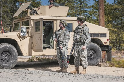 Spc. Renato Reyes, a petroleum fuel specialist with the 957th Quartermaster Company based in Denton, Texas, and Spc. Dillan Mitten, a native of Farmville, Texas, stands guard outside a refueling point during Combat Support Training Exercise 2016 at Joint Base McGuire-Dix-Lakehurst, N.J. March 8, 2016. CSTX is a U.S. Army Reserve exercise conducted at multiple locations across the country designed to challenge combat support units and Soldiers to improve and sustain skills necessary during a deployment. (U.S. Army photo by Sgt. Michael T. Crawford/RELEASED)