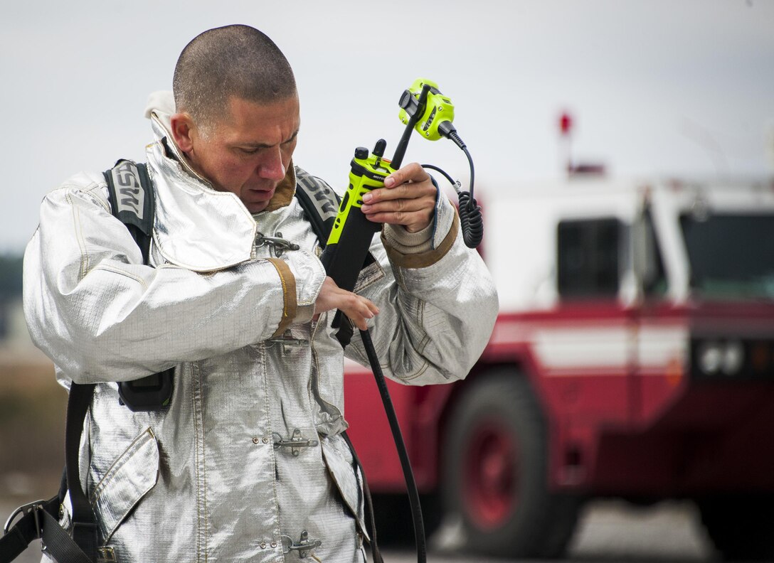 Tech. Sgt. Sam Cameron, 919th Special Operations Civil Engineer Squadron, gears up prior to a live-fire training exercise March 4 at Hurlburt Field, Fla.  The Reserve Airmen teamed with their active-duty special operations firefighters to complete their annual live-fire training during the March unit training assembly.  (U.S. Air Force photo/Tech. Sgt. Sam King)