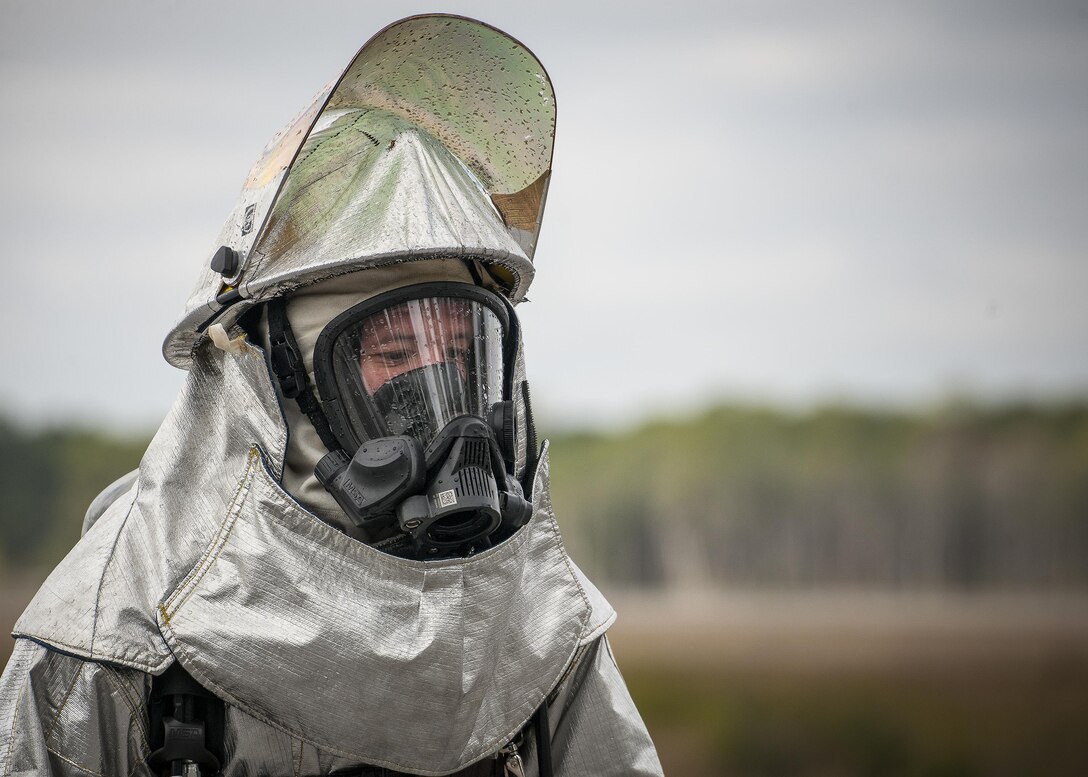 Tech. Sgt. Jeff Furman, 919th Special Operations Civil Engineer Squadron, takes a breather after a live-fire training exercise March 4 at Hurlburt Field, Fla.  The Reserve Airmen teamed with their active-duty special operations firefighters to complete their annual live-fire training during the March unit training assembly.  (U.S. Air Force photo/Tech. Sgt. Sam King)