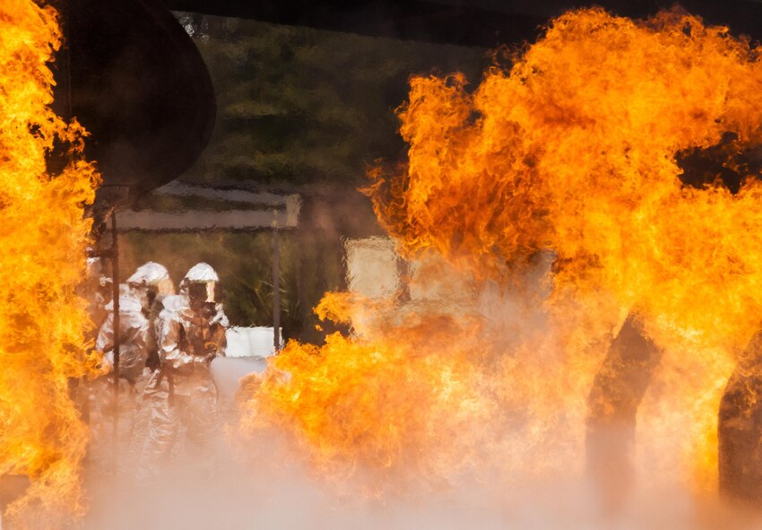 A team of 919th Special Operations Civil Engineer Squadron firefighters battle a huge blaze during a live-fire training exercise March 4 at Hurlburt Field, Fla.  The Reserve Airmen teamed with their active-duty special operations firefighters to complete their annual live-fire training during the March unit training assembly.  (U.S. Air Force photo/Tech. Sgt. Sam King)