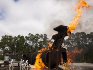 A team of 919th Special Operations Civil Engineer Squadron firefighters battle a huge blaze during a live-fire training exercise March 4 at Hurlburt Field, Fla.  The Reserve Airmen teamed with their active-duty special operations firefighters to complete their annual live-fire training during the March unit training assembly.  (U.S. Air Force photo/Tech. Sgt. Sam King)