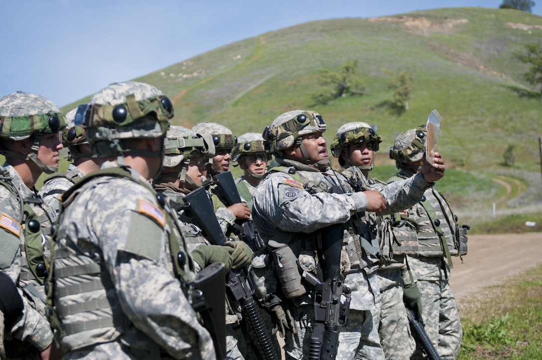 Staff Sgt. Ramon Brenescolon, a Soldier with the 475th Engineer Company (Horizontal), instructs his squad where the left and right limits of fire are during Combat Support Training Exercise 78-16-01 at Fort Hunter Liggett, Calif., March 8, 2016. CSTX 78-16-01 is a U.S. Army Reserve exercise conducted at multiple locations across the country designed to challenge combat support units and Soldiers to improve and sustain skills necessary during a deployment. (U.S. Army photo by Staff Sgt. Dalton Smith/Released)