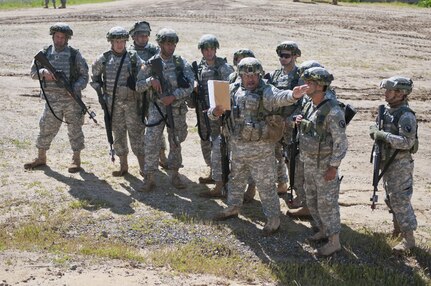 Staff Sgt. Ramon Brenescolon, a Soldier with the 475th Engineer Company (Horizontal), instructs his squad where the left and right limits of fire are during Combat Support Training Exercise 78-16-01 at Fort Hunter Liggett, Calif., March 8, 2016. CSTX 78-16-01 is a U.S. Army Reserve exercise conducted at multiple locations across the country designed to challenge combat support units and Soldiers to improve and sustain skills necessary during a deployment. (U.S. Army photo by Staff Sgt. Dalton Smith/Released)