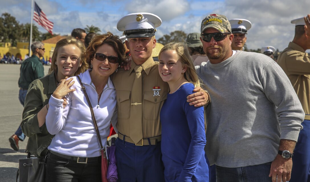 A Marine from India Company, 3rd Recruit Training Battalion, greets his family after graduating from recruit training at Marine Corps Recruit Depot San Diego, March 11. Following graduation, Marines are given 10 days of leave before taking the next step in training at the School of Infantry at Marine Corps Base Camp Pendleton, Calif. Annually, more than 17,000 males recruited from the Western Recruiting Region are trained at MCRD San Diego.
