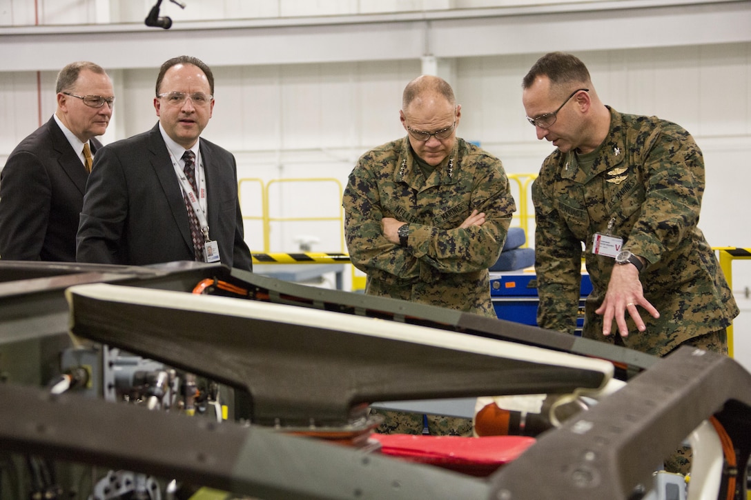 Commandant of the Marine Corps Gen. Robert B. Neller looks at a CH-53K King Stallion aircraft at Sikorsky Aircraft Corporation, Jupiter, Fla., March 8, 2016. Neller visited the facility to get an overview of the CH-53K program and visit Marines. (U.S. Marine Corps photo by Staff Sgt. Gabriela Garcia/Released)