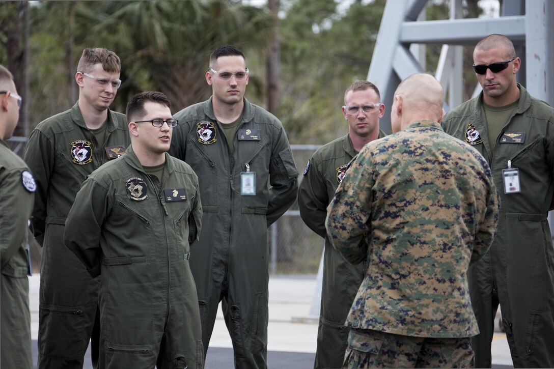 Commandant of the Marine Corps Gen. Robert B. Neller listens to a Marine maintainer, with CH-53K Super Stallion aircraft Marine Detachment, at Sikorsky Aircraft Corporation, Jupiter, Fla., March 8, 2016. Neller visited the facility to get an overview of the CH-53K program and visit Marines. (U.S. Marine Corps photo by Staff Sgt. Gabriela Garcia/Released)