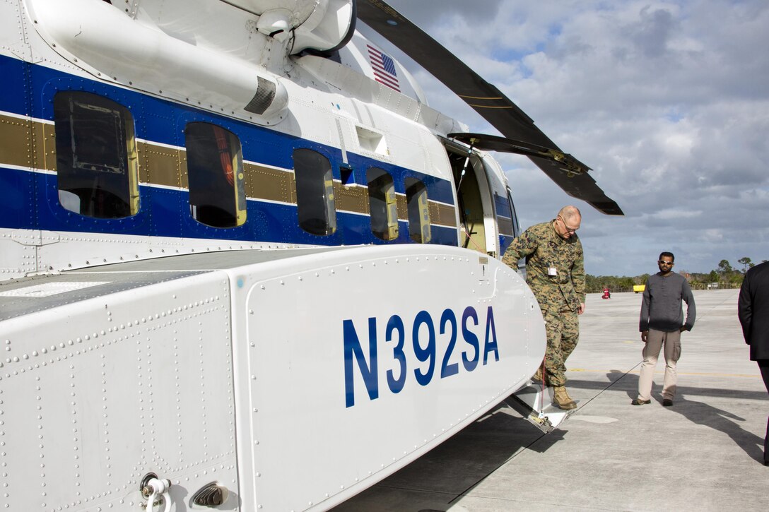 Commandant of the Marine Corps Gen. Robert B. Neller steps out of a CH-53K King Stallion aircraft at Sikorsky Aircraft Corporation, Jupiter, Fla., March 8, 2016. Neller visited the facility to get an overview of the CH-53K program and visit Marines. (U.S. Marine Corps photo by Staff Sgt. Gabriela Garcia/Released)