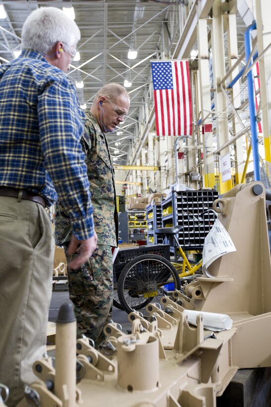 Commandant of the Marine Corps Gen. Robert B. Neller looks at equipment during a tour of Marine Depot Maintenance Command at Albany, Ga., March 9, 2016. Neller toured the repair facility to assess its operational capabilities and meet the Marines and civilian employees. (U.S. Marine Corps photo by Staff Sgt. Gabriela Garcia/Released)