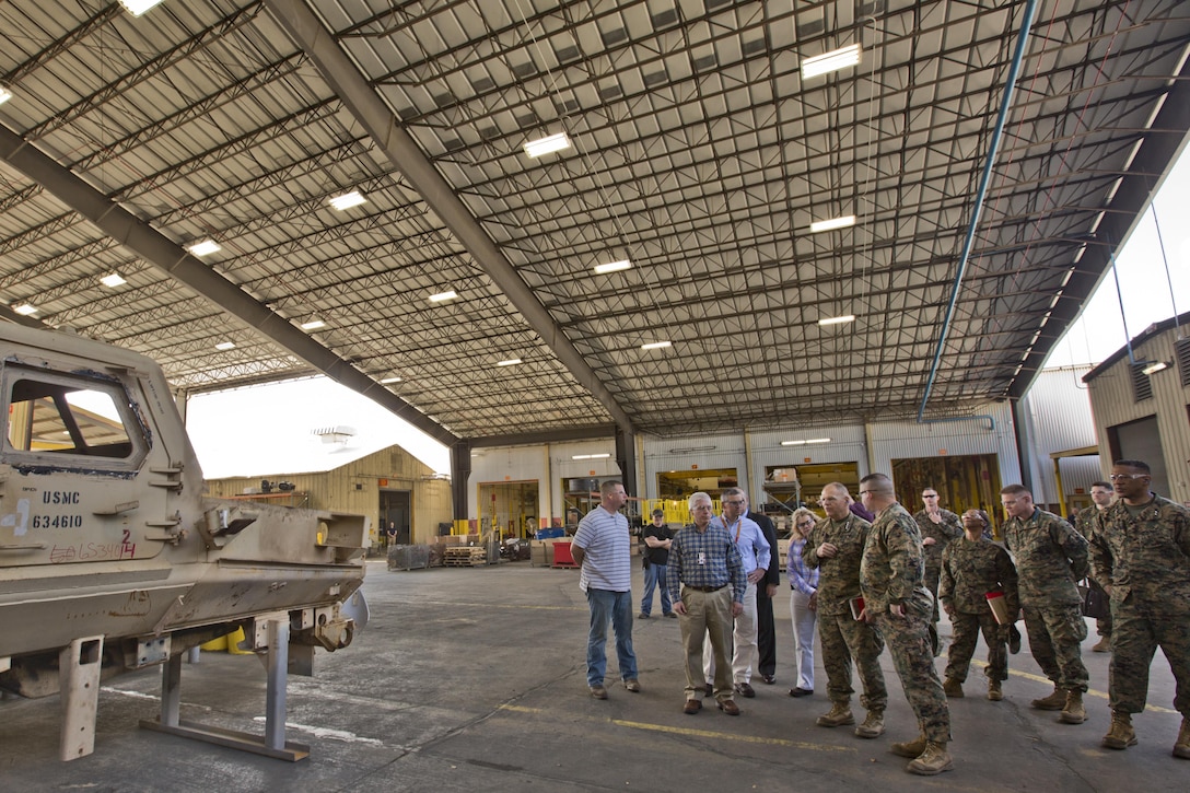 Commandant of the Marine Corps Gen. Robert B. Neller listens to a brief during a tour of Marine Depot Maintenance Command at Albany, Ga., March 9, 2016. Neller toured the repair facility to assess its operational capabilities and meet the Marines and civilian employees. (U.S. Marine Corps photo by Staff Sgt. Gabriela Garcia/Released)