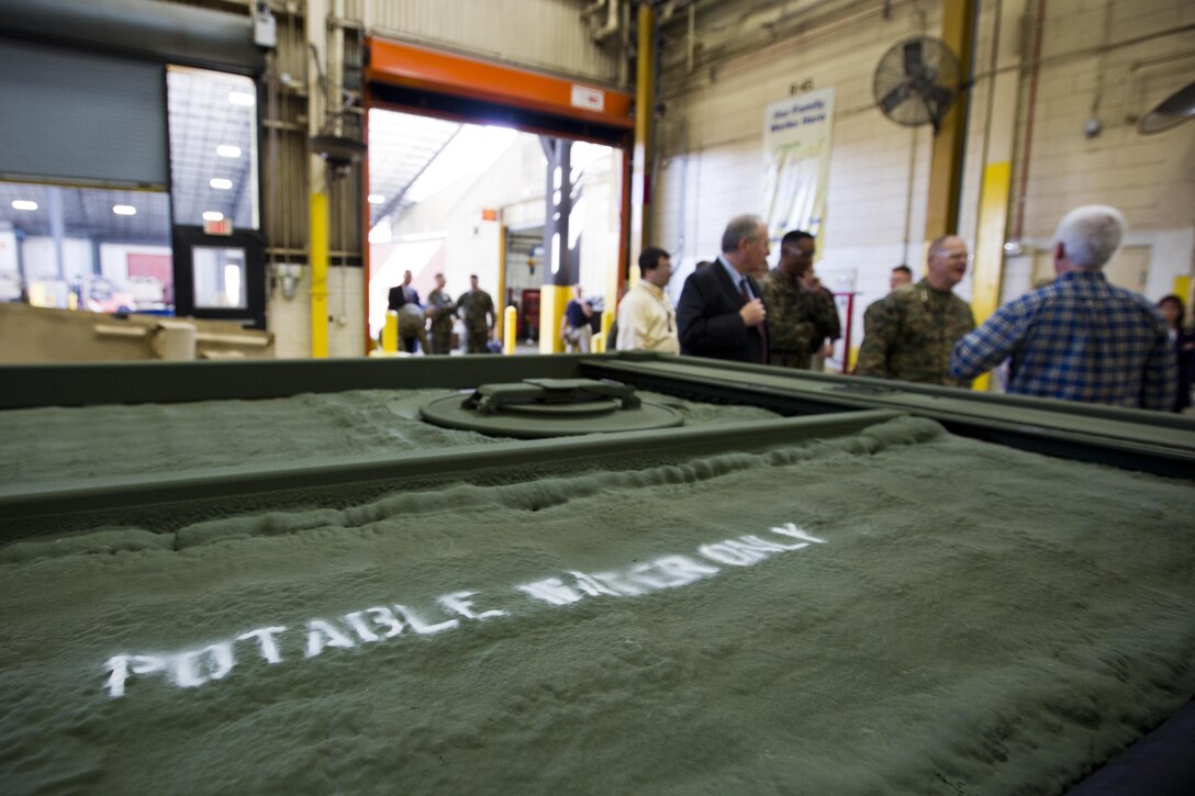 Commandant of the Marine Corps Gen. Robert B. Neller, right center, tours Marine Depot Maintenance Command at Albany, Ga., March 9, 2016. Neller toured the repair facility to assess its operational capabilities and meet the Marines and civilian employees. (U.S. Marine Corps photo by Staff Sgt. Gabriela Garcia/Released)