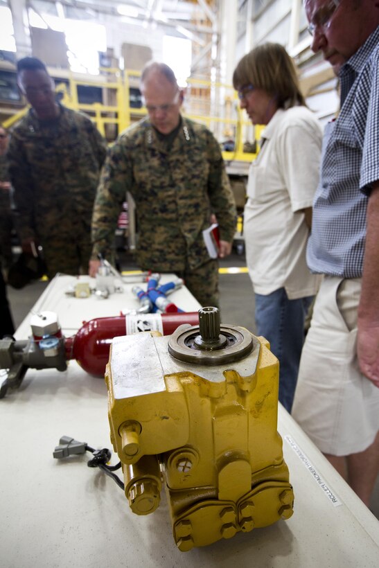 Commandant of the Marine Corps Gen. Robert B. Neller listens to a brief during a tour of Marine Depot Maintenance Command at Albany, Ga., March 9, 2016. Neller toured the repair facility to assess its operational capabilities and meet the Marines and civilian employees. (U.S. Marine Corps photo by Staff Sgt. Gabriela Garcia/Released)