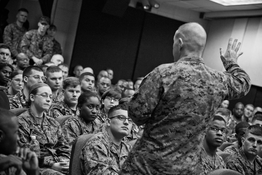 Commandant of the Marine Corps Gen. Robert B. Neller visits Marine Corps Logistics Command at Marine Depot Maintenance Command, Albany, Ga., March 9, 2016. Neller briefed Marines, Sailors, and civilians on the current status of the Corps, his expectations, and priorities, and the imortance of protecting what each Marine has earned. (U.S. Marine Corps photo illustration by Staff Sgt. Gabriela Garcia/Released)