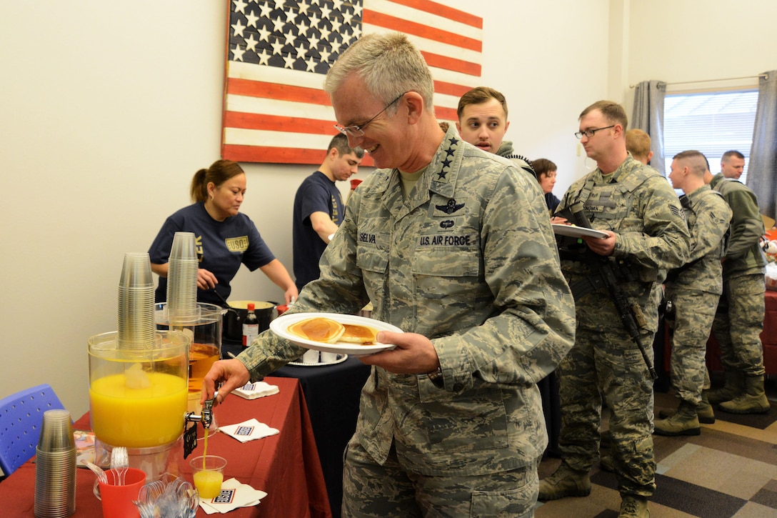 Air Force Gen. Paul J. Selva, vice chairman of the Joint Chiefs of Staff, helps himself to breakfast with airmen on Joint Base Elmendorf-Richardson, Alaska, March 12, 2016, during the USO spring tour. Air Force photo by Airman 1st Class Christopher R. Morales